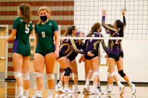 Lake Stevens' celebrate a point against Edmonds-Woodway Tuesday night at Edmonds-Woodway High School in Edmonds on September 7, 2021. The Vikings won in straight sets. (Kevin Clark / The Herald)