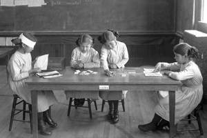 Interior of Tulalip Indian School with students demonstrating learning procedures.  Possibly taken May 13, 1914 for a photo exhibit shown at the Panama Exposition. (J.A. Juleen / Everett Public Library's Northwest History Room)