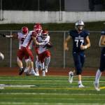 Gaylan Gray celebrates with teammates after one of his touchdowns. (Olivia Vanni / The Herald)