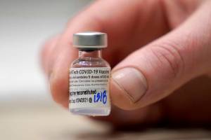 FILE - In this  Jan. 24, 2021, file photo, a vial of the Pfizer vaccine for COVID-19 is shown at a one-day vaccination clinic set up in an Amazon.com facility in Seattle and operated by Virginia Mason Franciscan Health. Pfizer announced Wednesday, March 31, 2021 that its COVID-19 vaccine is safe and strongly protective in kids as young as 12, a step toward possibly beginning shots in this age group before they head back to school in the fall. (AP Photo/Ted S. Warren, File)