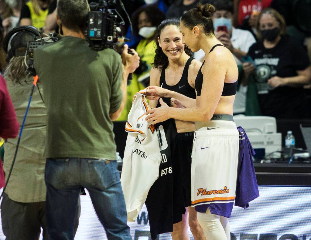 Seattle Storms Sue Bird and Phoenixs Diana Taurasi trade jerseys after the second-round, single elimination playoff game at Angel of the Winds Arena on Sunday in Everett. (Olivia Vanni / The Herald)