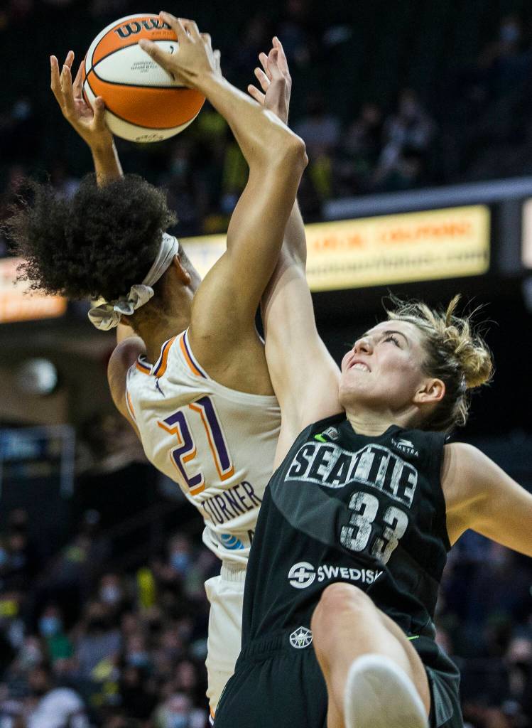 Seattle Storms Katie Lou Samuelson tries to block a shot by Phoenixs Brianna Turner during the second-round, single elimination playoff game at Angel of the Winds Arena on Sunday in Everett. (Olivia Vanni / The Herald)