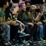 Megan Rapinoe cheers courtside during the second-round, single elimination playoff game against the Phoenix Mercury at Angel of the Winds Arena on Sunday in Everett. (Olivia Vanni / The Herald)