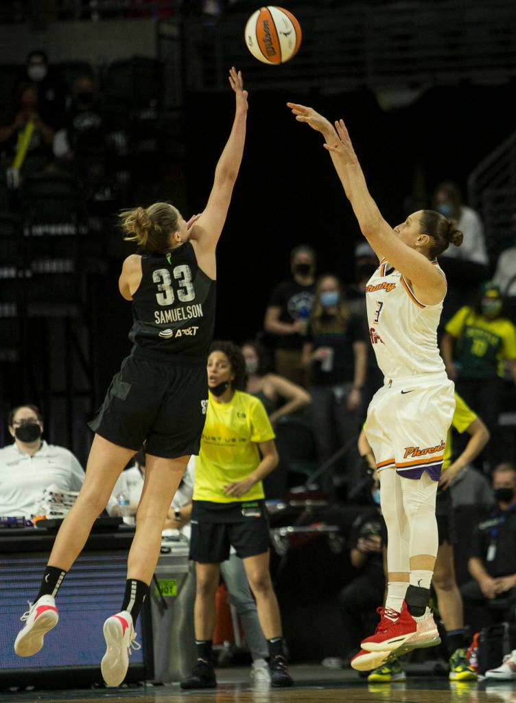 Seattle Storms Katie Lou Samuelson jumps to block a 3-point shot by Phoenixs Diana Taurasi during the second-round, single elimination playoff game at Angel of the Winds Arena on Sunday in Everett. (Olivia Vanni / The Herald)