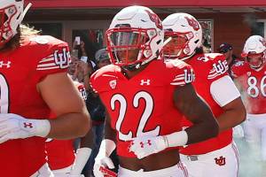 Utah cornerback Aaron Lowe (22) runs onto the field before an NCAA college football game against Washington State on Saturday, Sept. 25, 2021, in Salt Lake City, Utah. A University of Utah football player has been killed in a shooting at a house party early Sunday, Sept. 26, 2021, Salt Lake City police said. The shooting that killed Aaron Lowe occurred just after midnight, only hours after the Utes beat Washington State 24-13. Police said another victim in the attack was in critical condition and authorities were searching for a suspect. (AP Photo/George Frey)