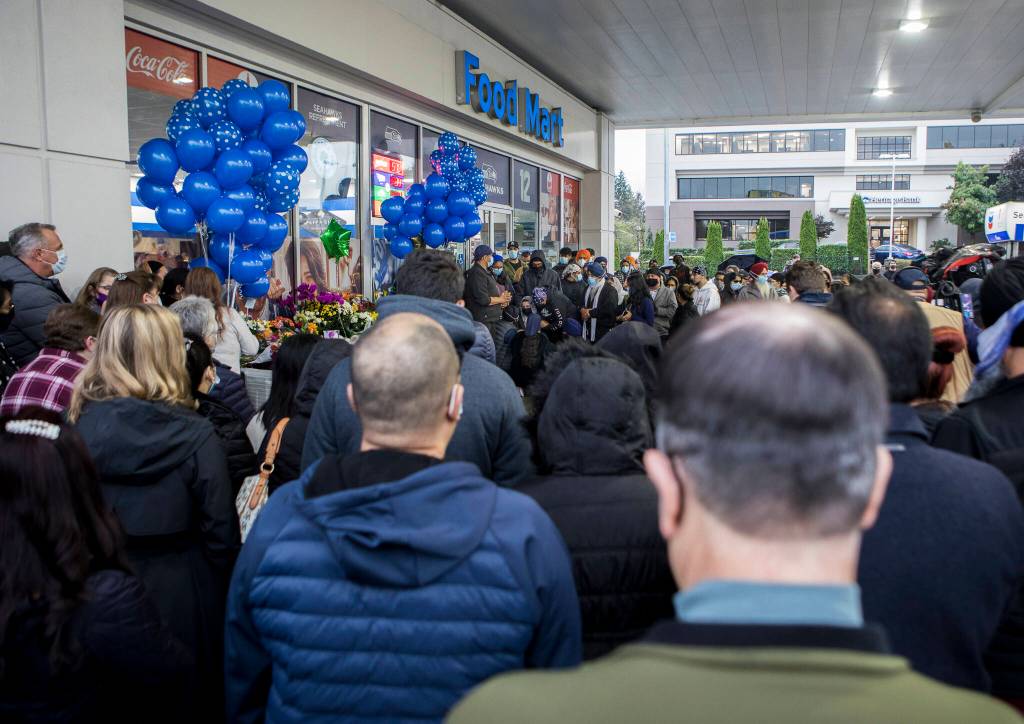 People gather at the candlelight vigil for TejPal Singh on Wednesday in Lynnwood. (Olivia Vanni / The Herald)