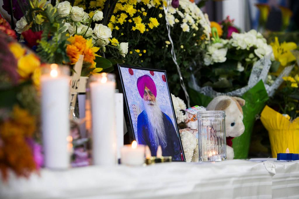 A photograph of TejPal Singh sits on a memorial table at his candlelight vigil on Wednesday, Sept. 29, 2021 in Lynnwood, Wa. (Olivia Vanni / The Herald)