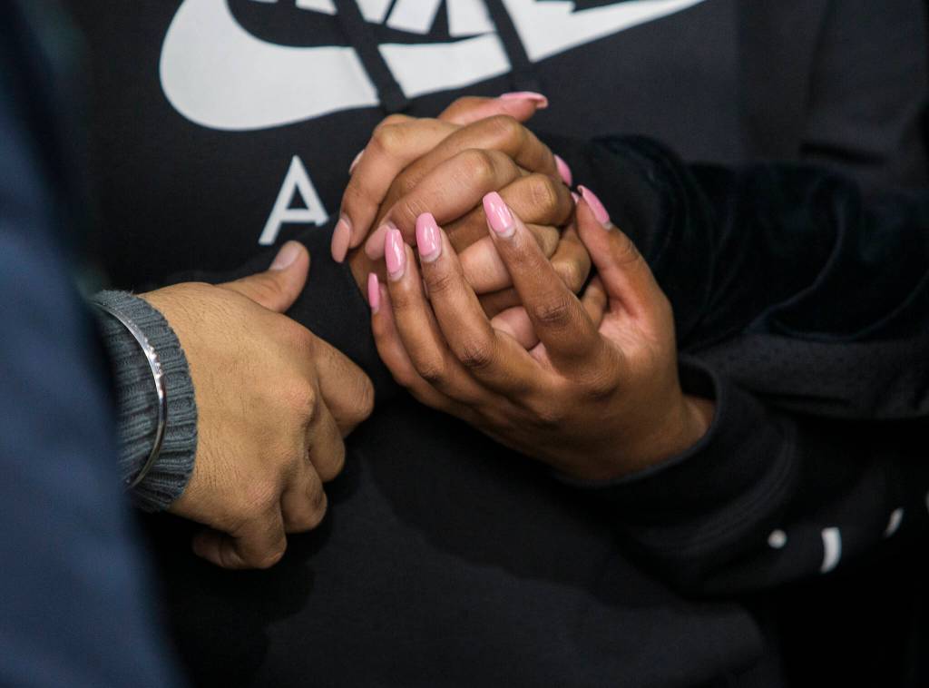 TejPal Singha children hold hands at his candlelight vigil on Wednesday, Sept. 29, 2021 in Lynnwood, Wa. (Olivia Vanni / The Herald)
TejPal Singha children hold hands at his candlelight vigil on Wednesday, Sept. 29, 2021 in Lynnwood, Wa. (Olivia Vanni / The Herald)