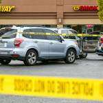 The scene where police from a King County agency shot a man at the end of a car chase Monday afternoon, in a Safeway parking lot south of Snohomish. (Kevin Clark / The Herald)