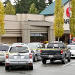 The scene where police from a King County agency shot a man at the end of a car chase Monday afternoon, in a Safeway parking lot south of Snohomish. (Kevin Clark / The Herald)