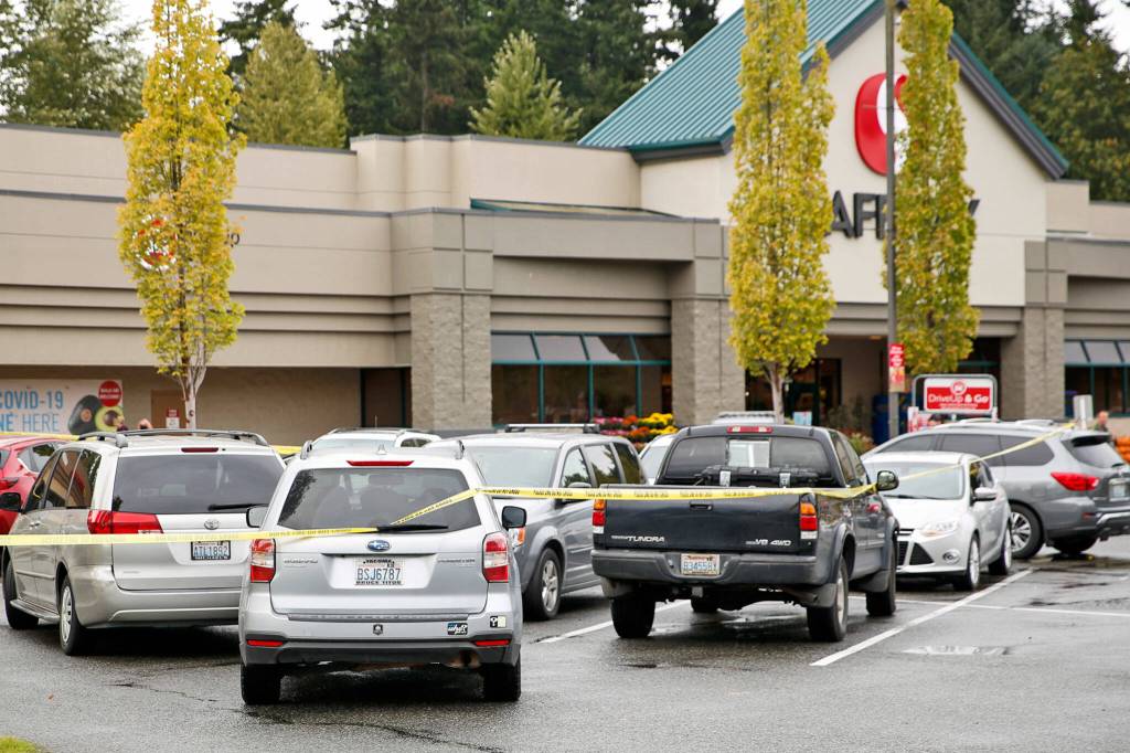 The scene where police from a King County agency shot a man at the end of a car chase Monday afternoon, in a Safeway parking lot south of Snohomish. (Kevin Clark / The Herald)