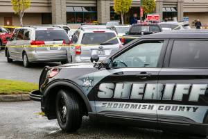 The scene where police from a King County agency shot a man at the end of a car chase Monday afternoon in a Safeway parking lot in Snohomish on September, 27, 2021.  (Kevin Clark / The Herald)