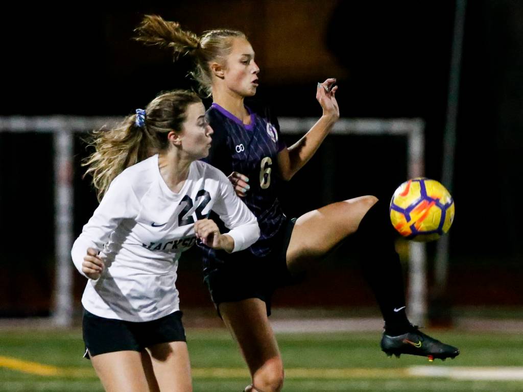 Lake Stevens Camryn Peterson, left, controls the ball the Jacksons Maggie Aydelott Tuesday night at Lake Stevens High School on September 28, 2021. (Kevin Clark / The Herald)