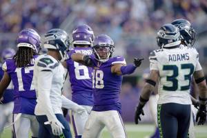 Minnesota Vikings wide receiver Justin Jefferson (18) reacts to a play during the second half an NFL football game against the Seattle Seahawks, Sunday, Sept. 26, 2021 in Minneapolis. Minnesota won 30-17. (AP Photo/Stacy Bengs)
