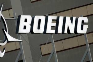 FILE - This Jan. 25, 2011, file photo, shows the Boeing Company logo on the property in El Segundo, Calif. Chicago-based aerospace giant Boeing has announced plans to build a new type of drone military aircraft in Australia. Boeing said Wednesday, Sept. 22, 2021 it has selected Toowoomba city in Queensland state as the final assembly point for its unmanned Loyal Wingman planes. The first test flights were completed earlier this year. (AP Photo/Reed Saxon, File)