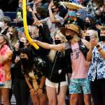 Arlingtons fans cheer a point against Snohomish Wednesday night at Arlington High School on September 29, 2021. The Eagles won in straight sets. (Kevin Clark / The Herald)