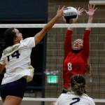 Arlingtons Chloe Fochesato attempts a kill with Snohomishs Reagan Bullock and Snohomishs Kelsey Nichols defending Wednesday night at Arlington High School on September 29, 2021. The Eagles won in straight sets. (Kevin Clark / The Herald)