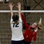 Arlingtons Ellie Salstrom attempts a block on Snohomishs Kelsey Nichols Wednesday night at Arlington High School on September 29, 2021. The Eagles won in straight sets. (Kevin Clark / The Herald)
