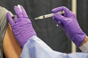 Natick, MA. - February 24: Antonio Loffa of Natick gets his COVID-19 vaccine at a mass vaccination site at the Natick Mall on February 24, 2021 in Natick, Massachusetts. POOL PHOTO  (Staff Photo By Matt Stone/MediaNews Group/Boston Herald)