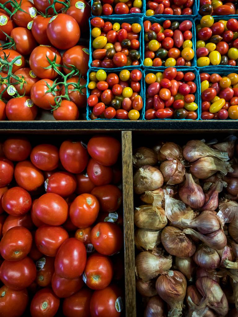 A selection of tomatoes and garlic at the Sno-Isle Food Co-op in Everett. (Olivia Vanni / The Herald)