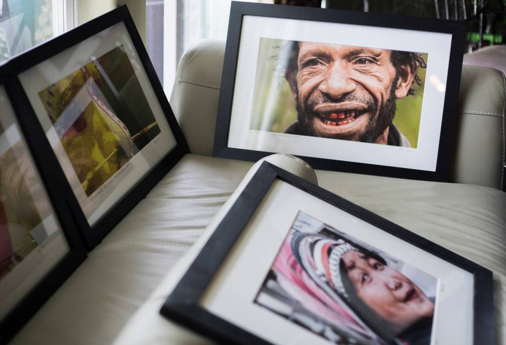 Framed photographs by Bob Fink. (Olivia Vanni / The Herald)