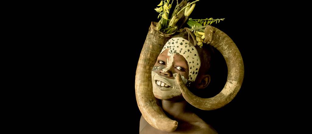 Boy by Bob Fink is a portrait of boy from the Mursi Tribe of the Omo Valley in Ethiopia.