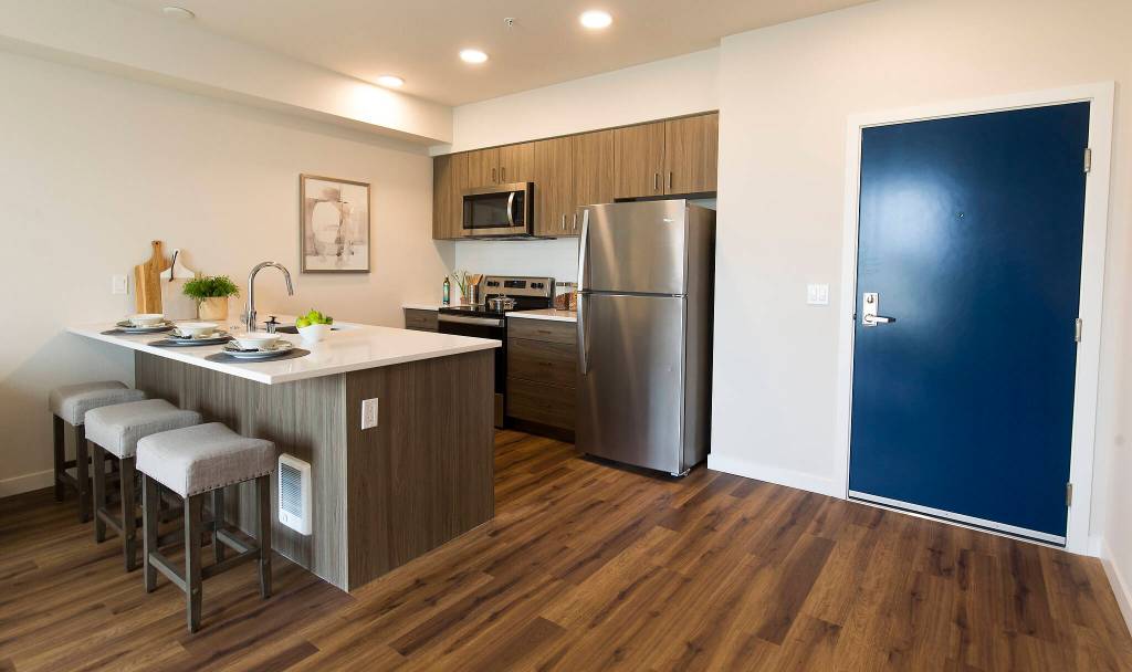 A kitchen in one of the 77 units of the Marquee Apartments in Everett. (Andy Bronson / The Herald)