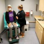 Deena Jones gets a physical by Briana Brewer during one of her twice weekly checkups Thursday morning at UW Medicine in Seattle on September 30, 2021. (Kevin Clark / The Herald)