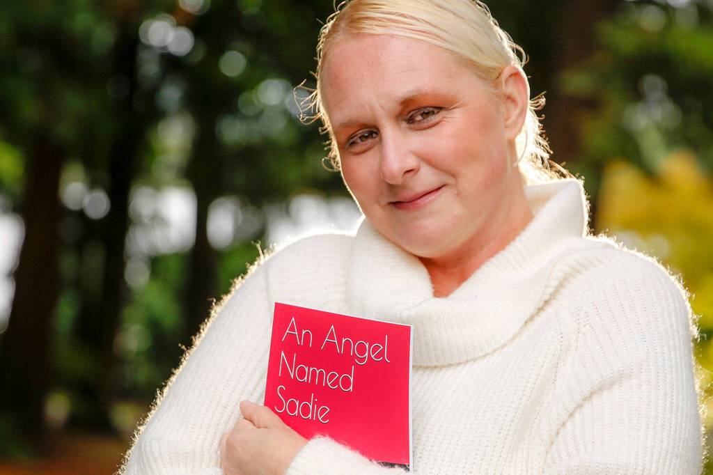 I spent 15 years quietly writing and rewriting the book, often through a veil of tears, Natalie Johnson said. (Kevin Clark / The Herald)