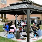 Haller Middle School sixth graders work on a class project in the school’s new outdoor classroom. (Arlington Public Schools)