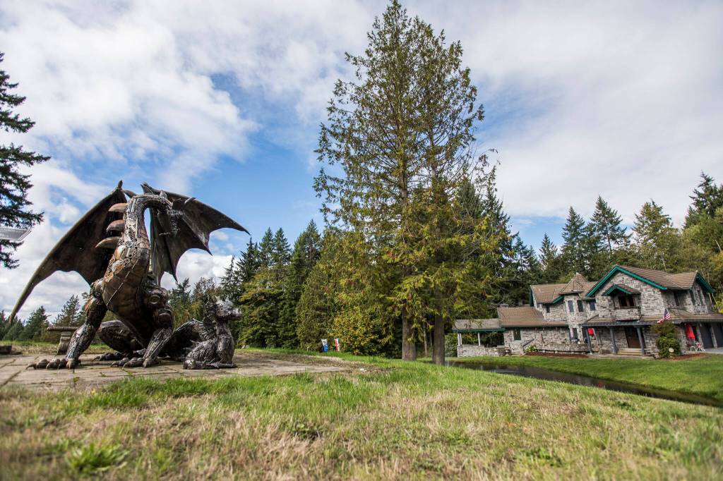 A dragon statue imported from Switzerland on display on the nearly 19-acre property. (Olivia Vanni / The Herald)