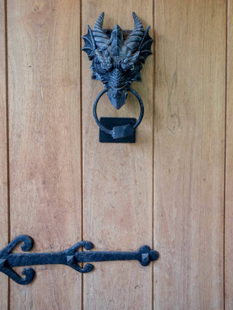 A dragon door knocker hangs from the front door. (Olivia Vanni / The Herald)