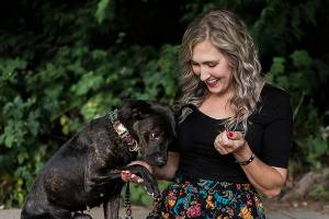Adriana Reedy and her "foster fail" Juniper at Hamlin Park on Sunday, Aug. 1, 2021 in Shoreline, Wash. (Olivia Vanni / The Herald)