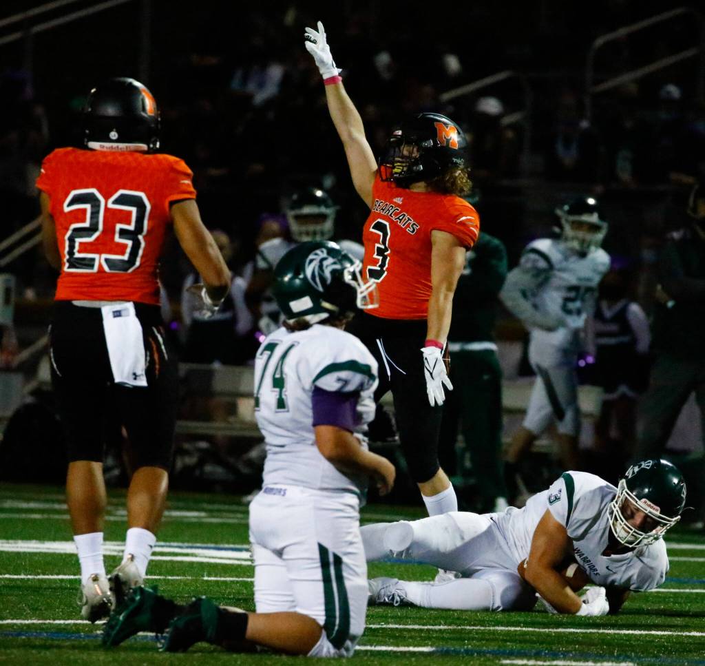 Monroes Vinnie Storhow tackles Edmonds-Woodways Ryan Fahey in the backfield for loss of yards Friday night at Monroe High School on October 1, 2021. (Kevin Clark / The Herald)