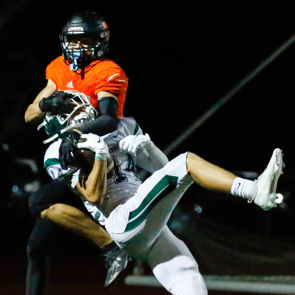 Edmonds-Woodways Major Gradwohl intercepts a pass intended for Monroes Eli Miller in the end zone Friday night at Monroe High School on October 1, 2021. (Kevin Clark / The Herald)