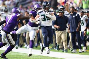 Seattle Seahawks tight end Will Dissly (89) carries the ball down the field against Minnesota Vikings middle linebacker Eric Kendricks (54) during an NFL football game, Sunday, Sept. 26, 2021 in Minneapolis. (AP Photo/Stacy Bengs)