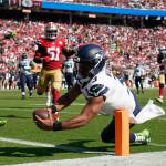 Seattle Seahawks quarterback Russell Wilson (3) runs for a touchdown against the San Francisco 49ers during the second half of Sundays game in Santa Clara, Calif. (AP Photo/Tony Avelar)