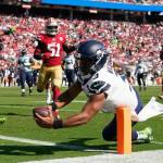 Seattle Seahawks quarterback Russell Wilson (3) runs for a touchdown against the San Francisco 49ers during the second half of an NFL football game in Santa Clara, Calif., Sunday, Oct. 3, 2021. (AP Photo/Tony Avelar)