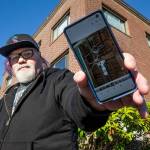 With new owners demanding the Grand Apartments' longtime residents leave, Stephen Teixeira, 52, documents issues at the Rockefeller Avenue building, on Thursday, Oct. 7, 2021 in Everett, Washington.  (Andy Bronson / The Herald)