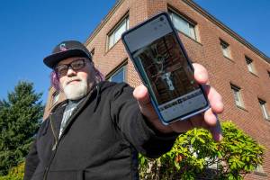 With new owners demanding the Grand Apartments' longtime residents leave, Stephen Teixeira, 52, documents issues at the Rockefeller Avenue building, on Thursday, Oct. 7, 2021 in Everett, Washington.  (Andy Bronson / The Herald)