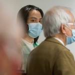 Duy Phuong Nguyen (center), 28, of Everett, listens to his interpreter (right) during a plea hearing at the Snohomish County Courthouse on Tuesday in Everett. (Andy Bronson / The Herald)