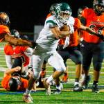 Edmonds-Woodway's Aaron Barraza rushes for the goal line a touchdown Friday night at Monroe High School on October 1, 2021.   (Kevin Clark / The Herald)