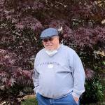Quail Park of Lynnwood resident Gary Hoskins takes in some of the gorgeous fall colors brightening up the garden.