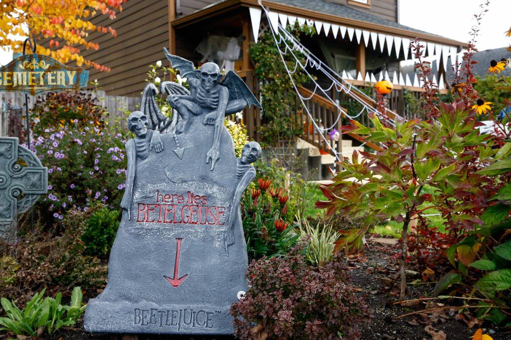 Halloween decorations drape the home of Cameo and Nick Beedle of Everett. (Kevin Clark / The Herald)