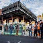 Northwest Union Carpenter members picket in front of the Marysville civic center construction site in Marysville Sept. 22, during a region-wide strike,. (Olivia Vanni / Herald file)