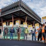 A handful of Northwest Union Carpenter members picket in front of the new Marysville civic center construction site on the sixth day of a region wide union carpenter strike on Wednesday, Sept. 22, 2021 in Marysville, Wa. (Olivia Vanni / The Herald)