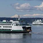 Ferries pass on a crossing between Mukilteo and Whidbey Island. (Andy Bronson / The Herald)