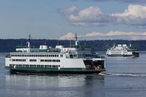 Ferries pass on a crossing between Mukilteo and Whidbey Island. File Photo by Andy Bronson/Daily Herald