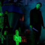 John Morrison, dressed up as movie character Michael Myers, wanders through a Halloween scene in Arlington. (Olivia Vanni / The Herald)