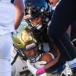 Lynnwoods Miguel Hurtado is tackled during a game against Everett on Friday in Edmonds. (Olivia Vanni / The Herald)